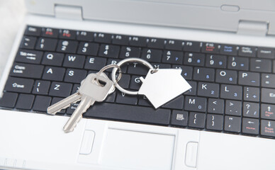 Wall Mural - House keys on the computer keyboard.