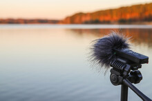 Portable Recorder Stands On A Tripod On The Lake Shore. Recording Sounds Of Nature