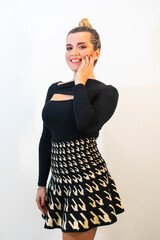 Poster - Vertical shot of an attractive caucasian woman posing in front of a white background