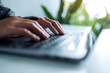 © Farknot Architect - Closeup image of a woman working and typing on laptop computer keyboard on the table