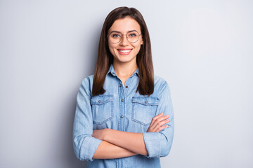 photo of optimistic cute long hairdo girl crossed arms wear spectacles blue cloth isolated on grey b