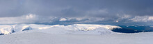 A Panorama Of A Snow-covered Mountain Range. Panorama From Multiple Shots.