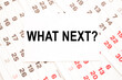 © Valeria - text WHAT NEXT on a sheet from Notepad.a digital background. business concept . business and Finance.
