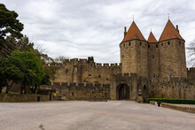 Fortifications Of The Medieval City Of Carcassonne, France. The Narbonnaise Gate, Was Built Around 1280 During The Reign Of Philip III The Bold And Was Made Up Of Two Enormous Spur Towers.