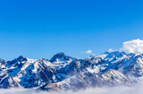 Fototapeta Góry - Snow and mountain peaks in the french Pyrenees near the Luchon Superbagnères Ski Resort in the Arrondissement of Saint-Gaudens, Occitania, Haute-Garonne, France. The Luchonnais Mountains aerial view.