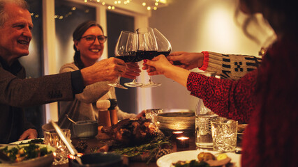 Wall Mural - Family toasting wine at christmas dinner