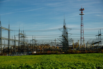 Power station with power lines and blue sky