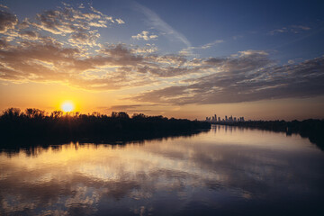 Wall Mural - Sunset over Vistula River and city downtown in Warsaw, capital of Poland - sunset view from Siekierkowski Bridge