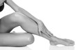 © Nobilior - Woman's legs with clean and smooth skin on white background, isolated