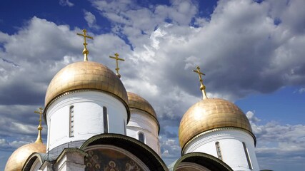 Wall Mural - Assumption Cathedral (Cathedral of the Dormition, Uspensky sobor) against the moving clouds. Inside of Moscow Kremlin, Russia (day)  