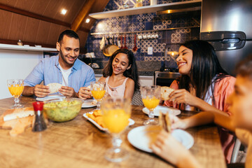 Wall Mural - Latin family having dinner at home