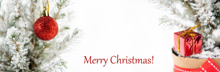 Wall Mural - Christmas tree decoration. Merry Christmas horizontal banner. Small tree isolated on white background.