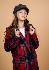 Wall Mural - childhood happiness. parisian retro look. french casual fashion. happy teen girl in checkered jacket. spring kid fashion style. child with curly hair wearing trendy hat. beauty as it is