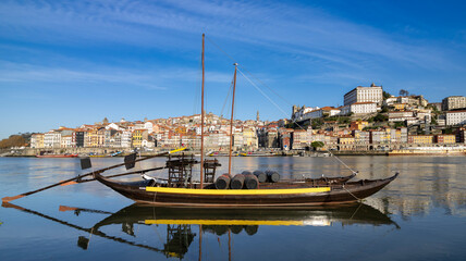 Wall Mural - Oporto, Portugal - Porto old town cityscape- Rabelo boat in Douro river.