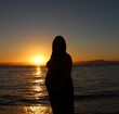 © Jssica - silhouette of a person on the beach at sunset
