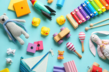Flat Lay Composition With Different Toys On Light Blue Background