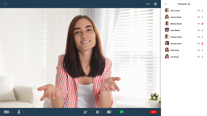 Wall Mural - Woman communicating with coworkers from home using video chat, view through camera