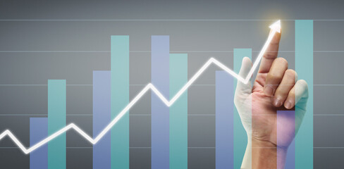 Hand touching a graphs of financial indicator accounting market economy analysis chart