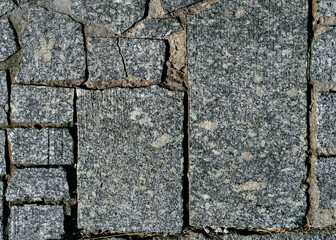 Wall Mural - Texture of gray granite paving stones, top view. Background from natural block stone.