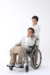 © stciel - 휠체어를 탄 남성과 여성 간병인