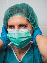 Hospital worker person with protective equipment for coronavirus Covid 19

