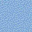 Abstract squiggle pattern background in blue and white. Fun modern design element of wavy lines in a tossed design 