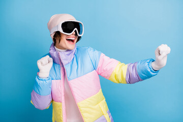 Photo of happy positive young woman wear sport ski clothes cheerful dance winter break isolated on blue color background