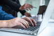 © Ngampol - Professional Developer programmer cooperation meeting and brainstorming and programming in website working a software outsourcing and coding technology, writing codes and database