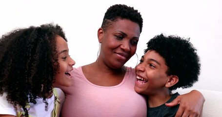 loving mother and kids hug. mom embracing children. african ethnicity