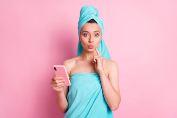 Sticker - Portrait of pretty nice young lady hold telephone blow kiss finger chin wear teal bath clothes isolated on pink background