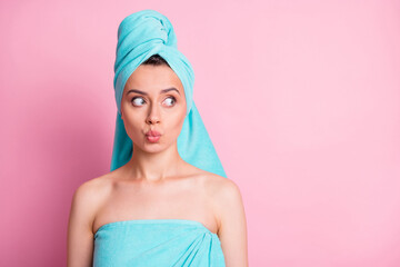 Sticker - Portrait of sweet nice young lady blow kiss look empty space wear teal bath towels on head body isolated on pink color background