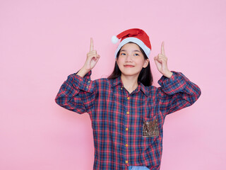 Wall Mural - Teenage girl wearing Santa Claus hat