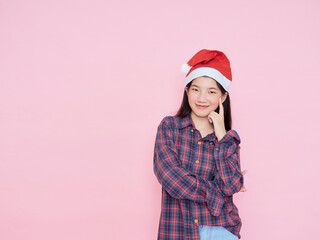 Wall Mural - teenage girl wearing santa hat