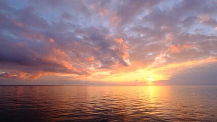 magical beautiful sunset on the beach. the sun dives into the golden waves. incredible sea landscape