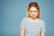 © SHOTPRIME STUDIO - Blonde girl in striped t-shirt lifestyle blue background fun