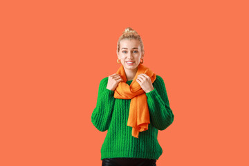 Sticker - Beautiful young woman in warm clothes on color background