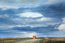 Abandoned Hut Against Cloudy Sky