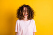 Photo portrait of laughing happy girl with stylish curly hairdo wearing t-shirt isolated on vibrant yellow color background