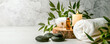 Leinwandbild Motiv beauty treatment items for spa procedures on white wooden table. massage stones, essential oils and sea salt. copy space