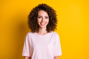 Canvas Print - Photo of young positive cheerful curly hair girl happy smile isolated over yellow color background