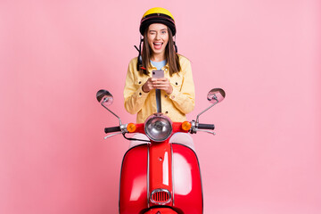 Wall Mural - photo of young positive beautiful girl woman wink use phone wear yellow helmet ride red motorbike is
