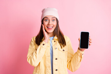 Wall Mural - portrait of attractive astonished person arm on cheek open mouth headwear cap isolated on pink color