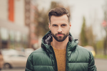 Poster - Portrait of good looking young bearded man look camera wearing warm outfit weekend walking outdoors