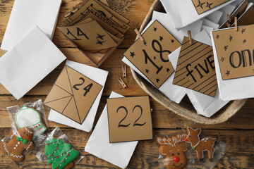 Wall Mural - Flat lay composition with gift bags and Christmas cookies on wooden table. Creating advent calendar