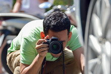 Man Photographing With Camera