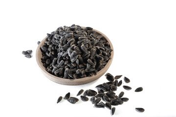 Sunflower seeds in a plate on a white background