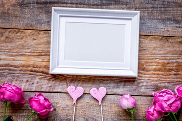 Spring design with peony flower and frame wooden background top view mock-up