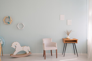 Wall Mural - Minimalistic nursery room with side cabinet, toys and wooden horse