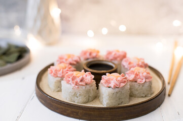 Wall Mural - Sushi roll with pink cream, salmon