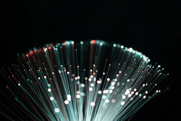 fiber optic abstract neon lights colorful background. close up view with bokeh. glowing optical fibe